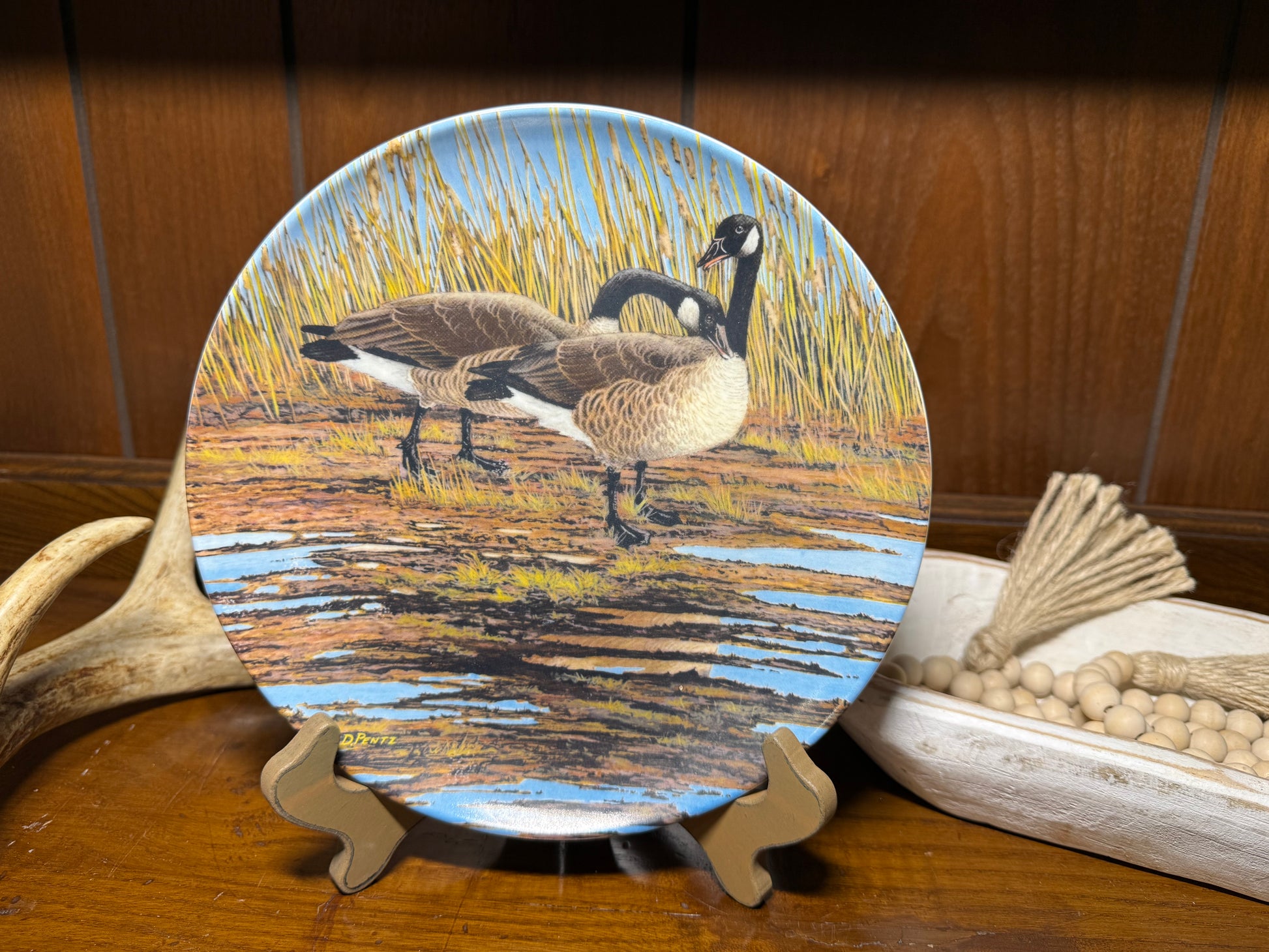 Vintage Canada Goose Plate "Courtship" by Donald Pentz, featuring detailed artwork of geese, from the Wings Upon the Wind series.