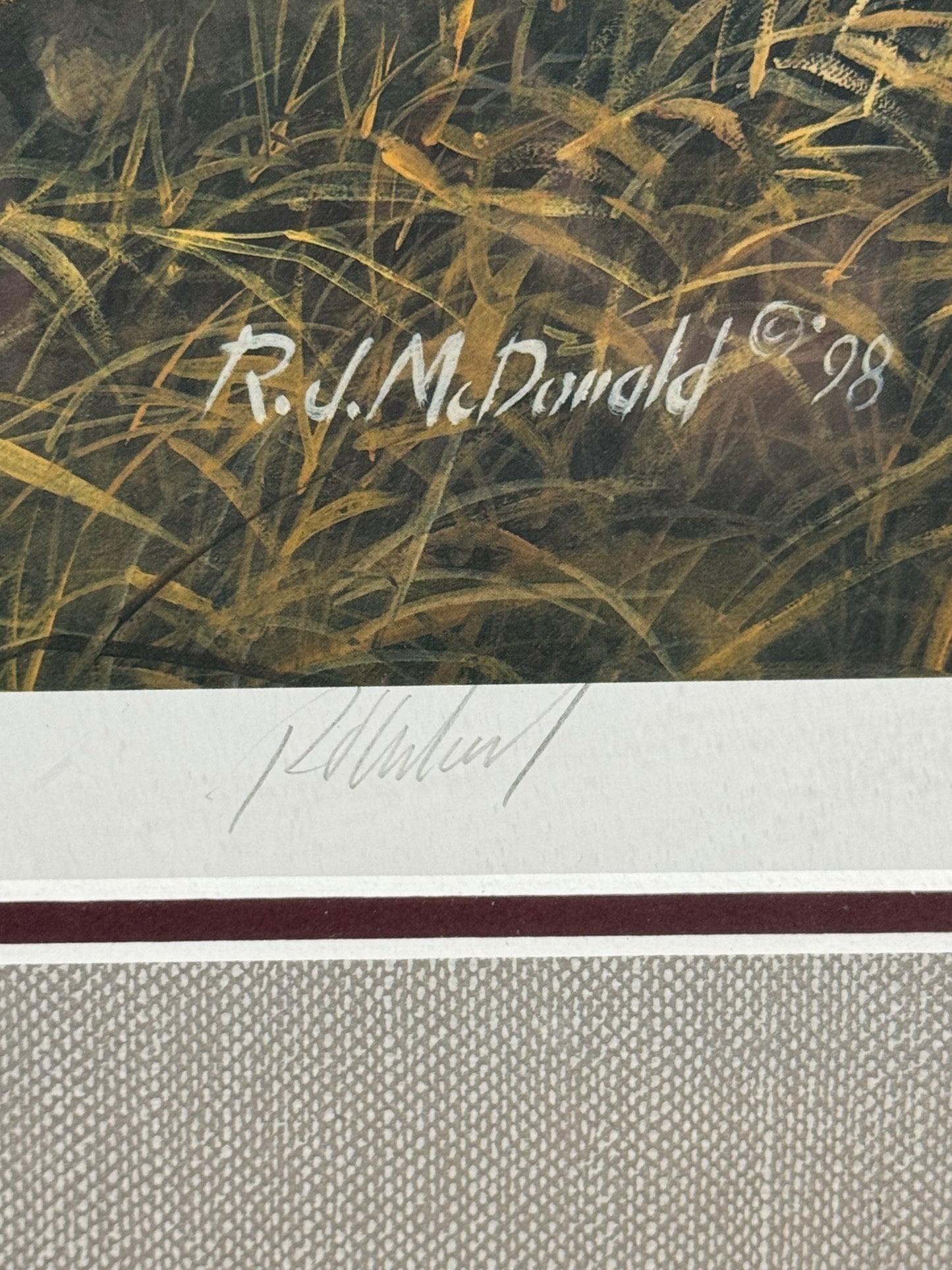 Signed Ducks Unlimited Greenwings framed print by R.J. McDonald, featuring detailed waterfowl artwork in a 27x32 inch display.