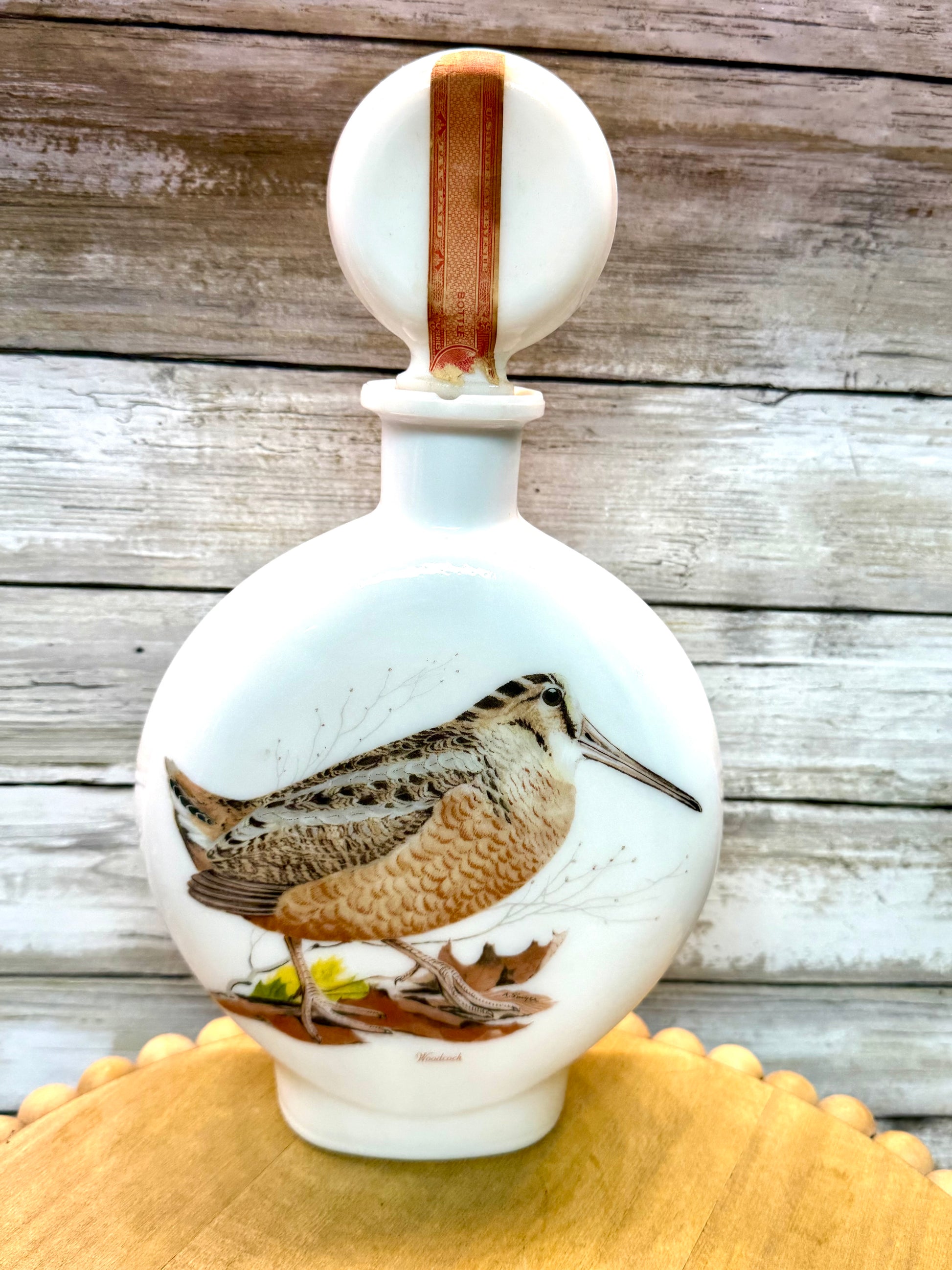 Vintage Wild Feathered Finds woodcock milk glass liquor decanter, edition No. 8 from 1969, featuring detailed bird design.