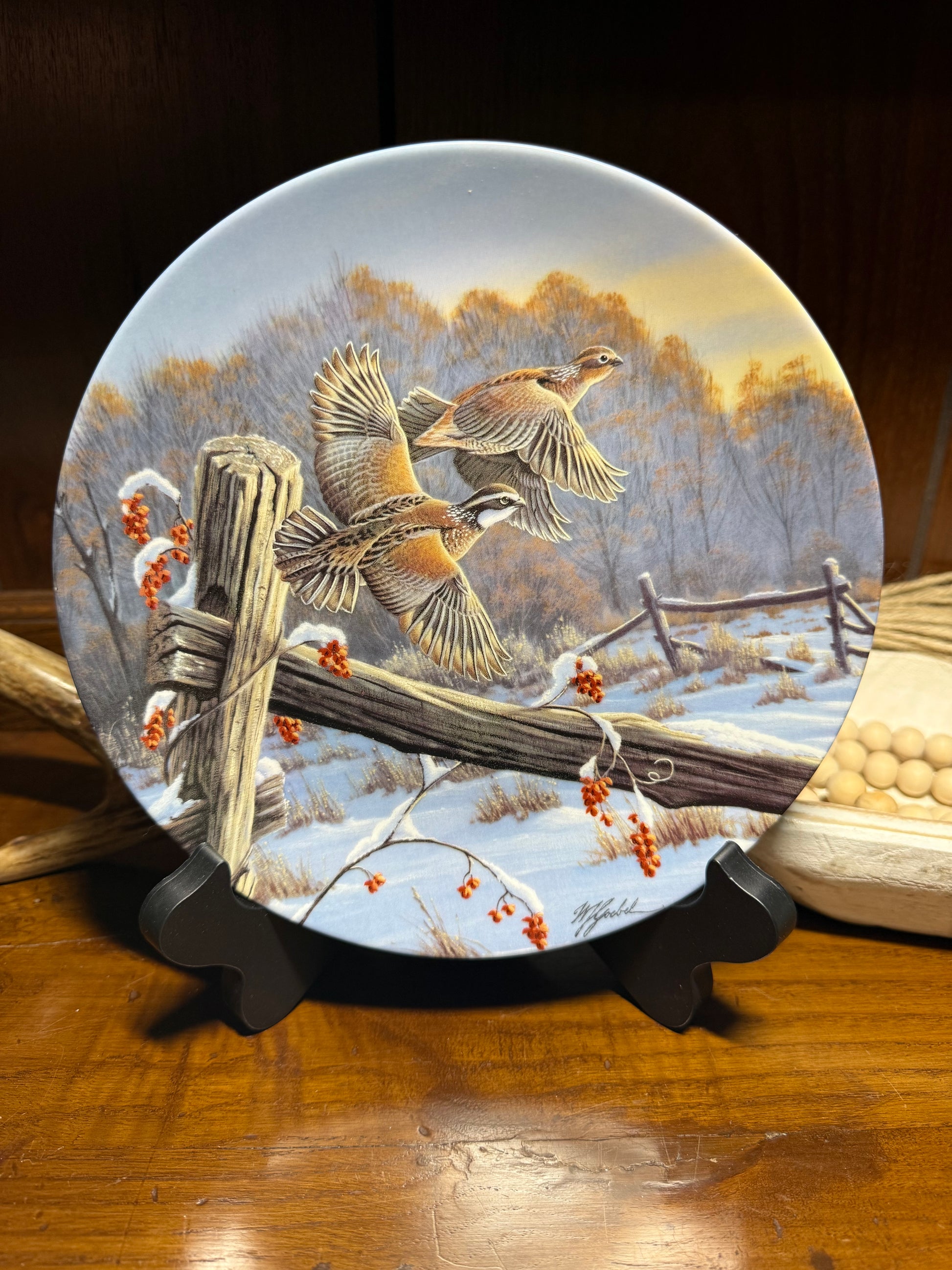 Wildlife collector plate "As Day Breaks" by Wilhelm J. Goebel, featuring golden winged birds, displayed with certificate of authenticity.