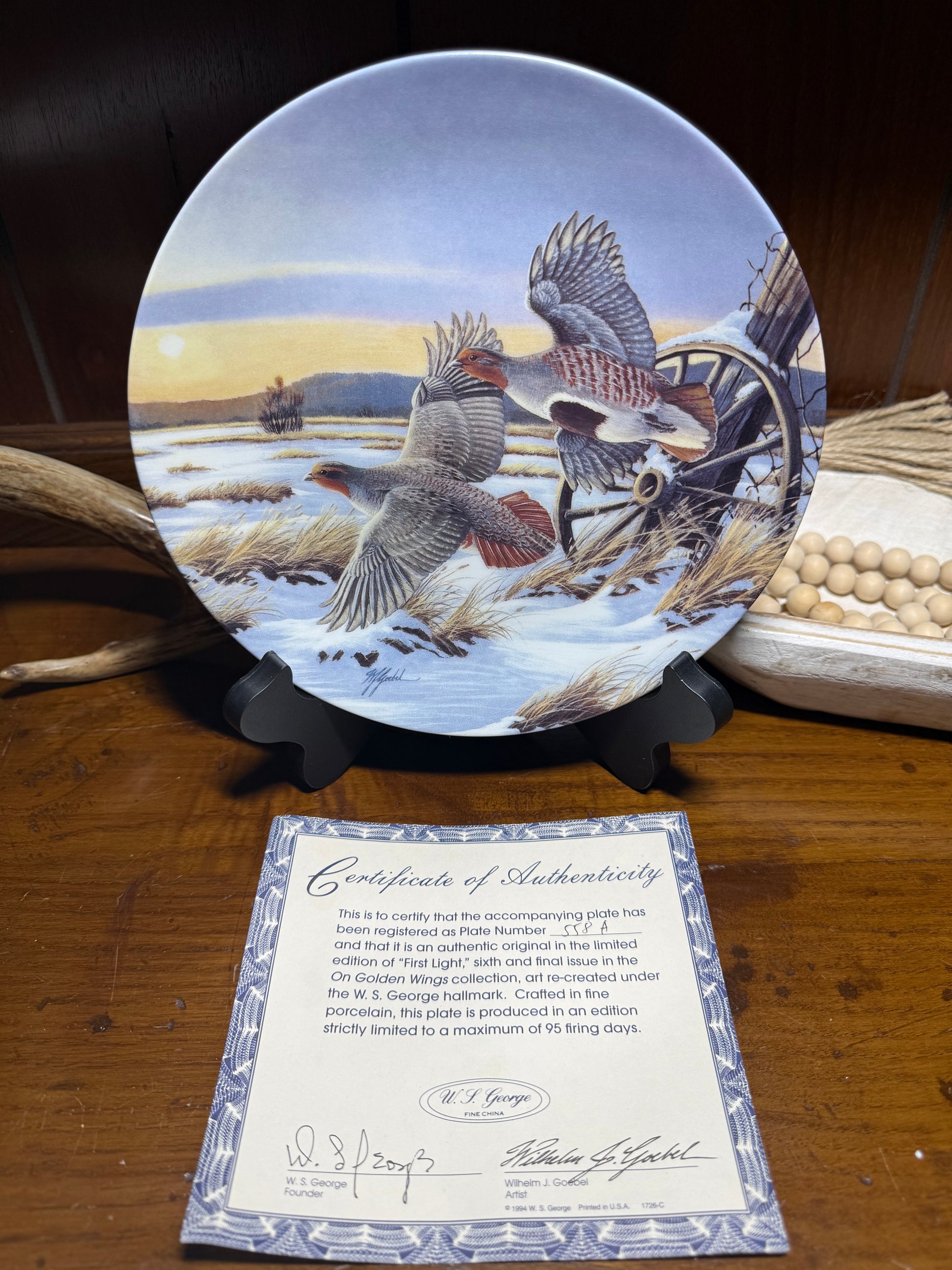 "Wilhelm J. Goebel 'First Light' wildlife collector plate on golden wings with COA, from W.S. George, featuring detailed bird artwork."