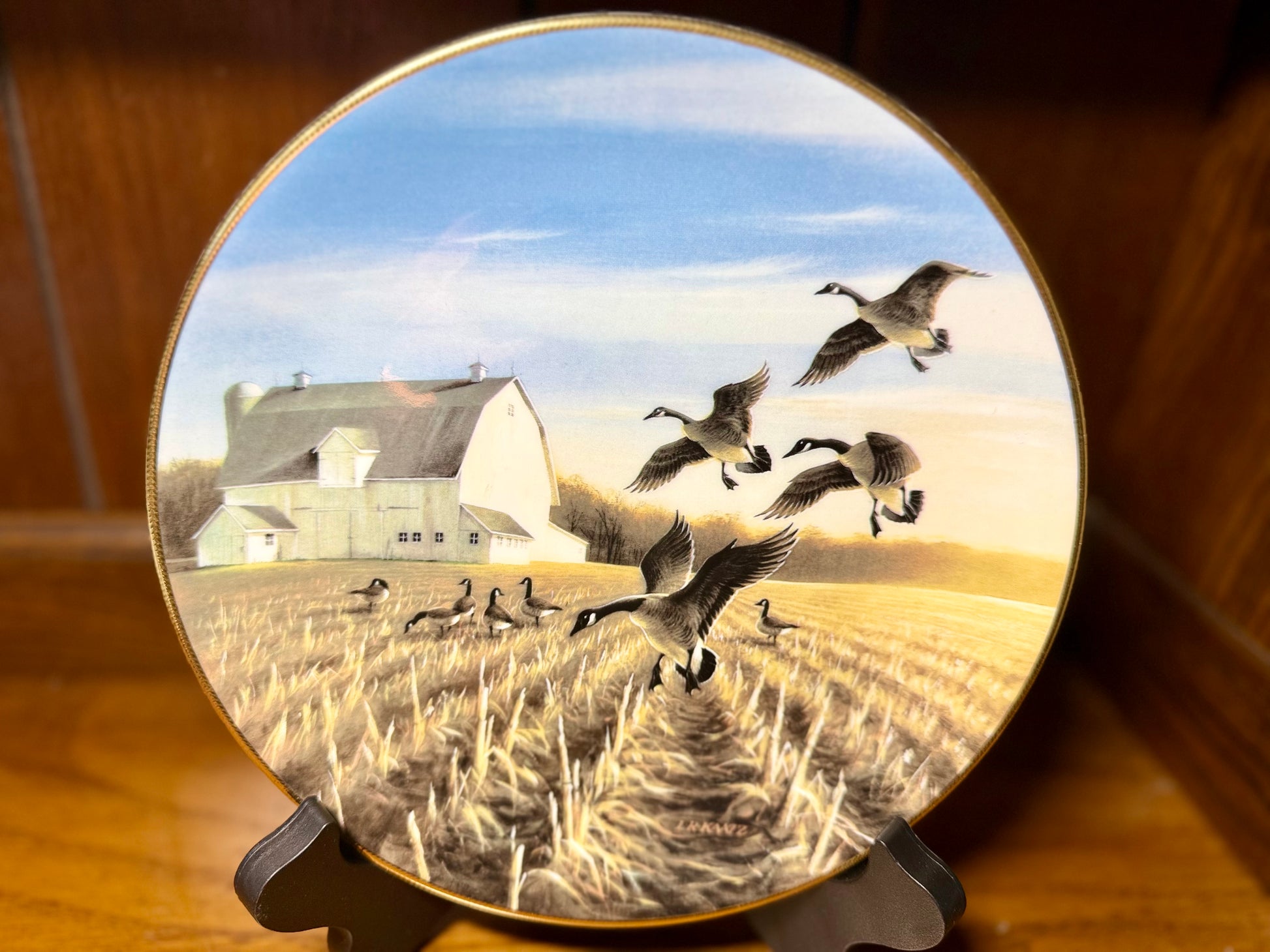 Ducks Unlimited Canada Geese in Autumn Field plate by Lynn Kaatz, 1988, featuring detailed artwork of geese in a fall landscape.