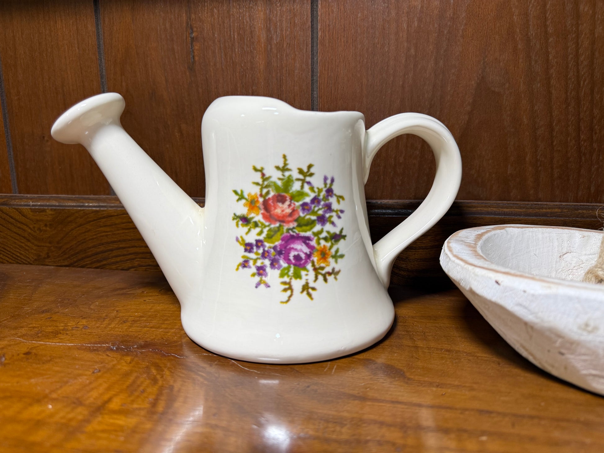 Vintage ceramic watering can planter with floral cottage style design, cream glazed pottery, ideal for indoor or outdoor plant display.