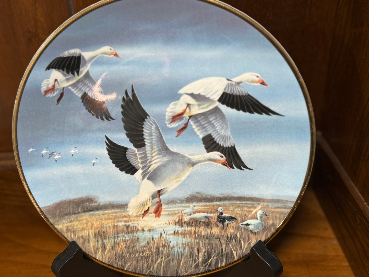 Ducks Unlimited Snow Geese against November skies plate by Lynn Kaatz, 1990, from Wild Feathered Finds collection.