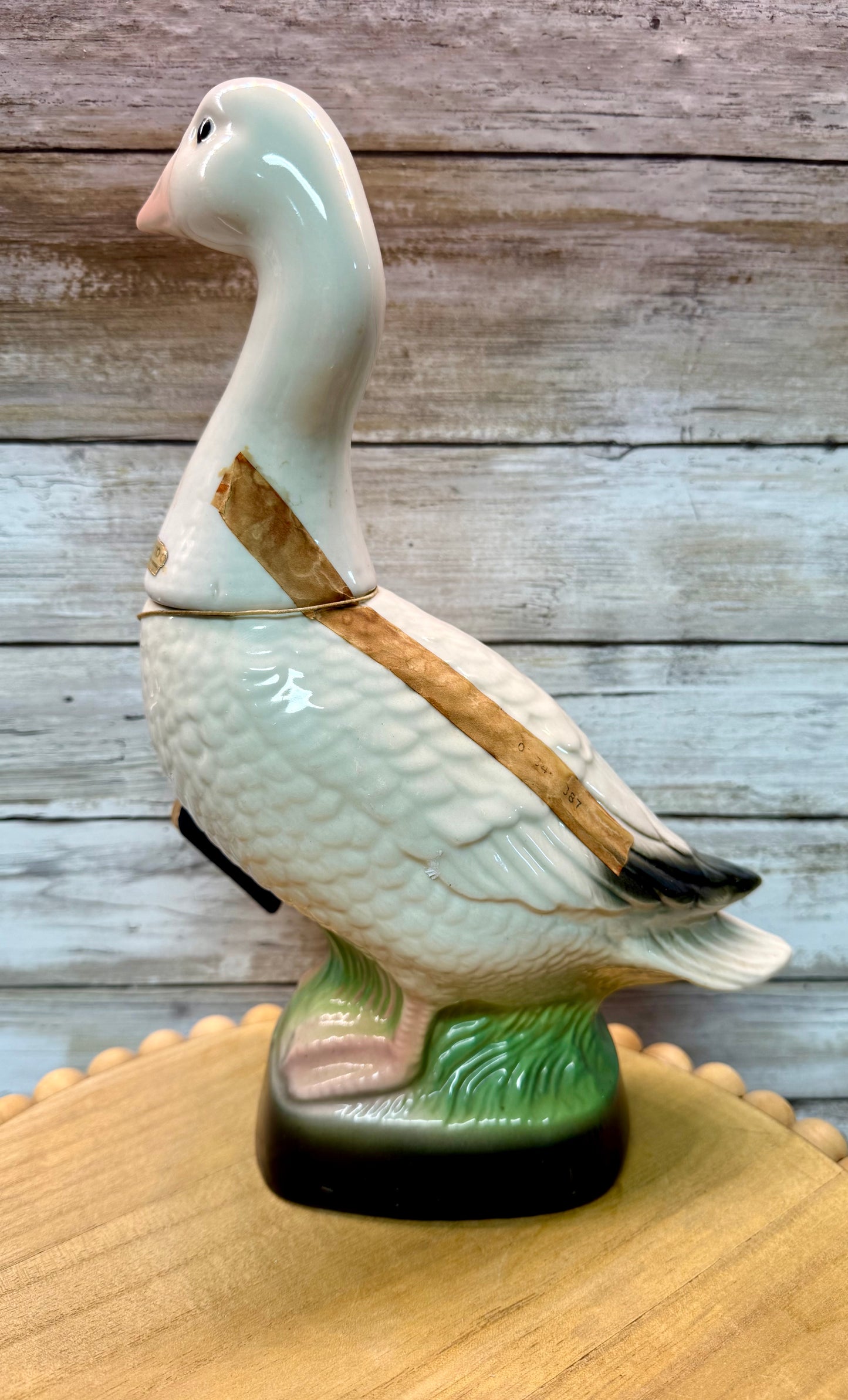 Vintage Jim Beam Snow Goose ceramic decanter from The Beam Collection First in Series by Wild Feathered Finds, with detailed goose design.