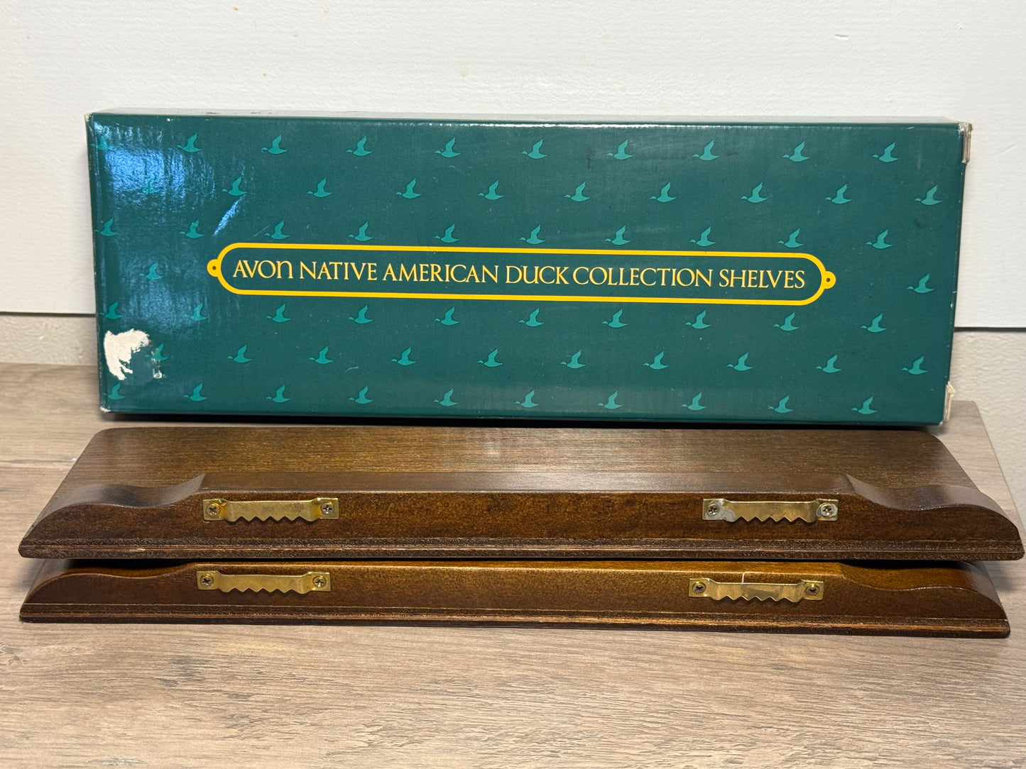 Vintage Avon duck collection display shelves set of 2 wood wall shelves with decorative duck figures and storage boxes.