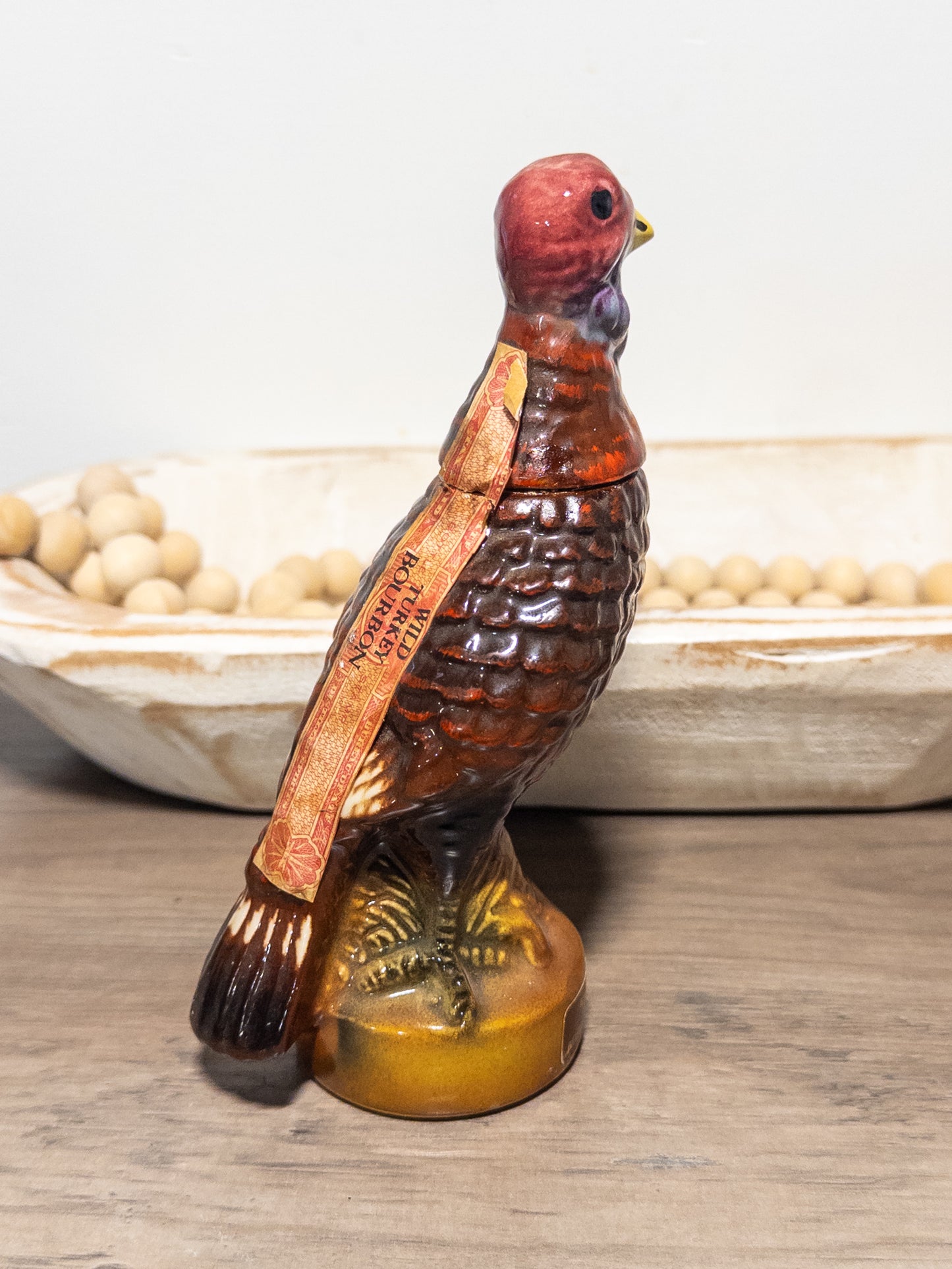 Vintage Wild Turkey ceramic decanter featuring Wild Feathered Finds branding, 101 proof bourbon bottle from the 1970s.
